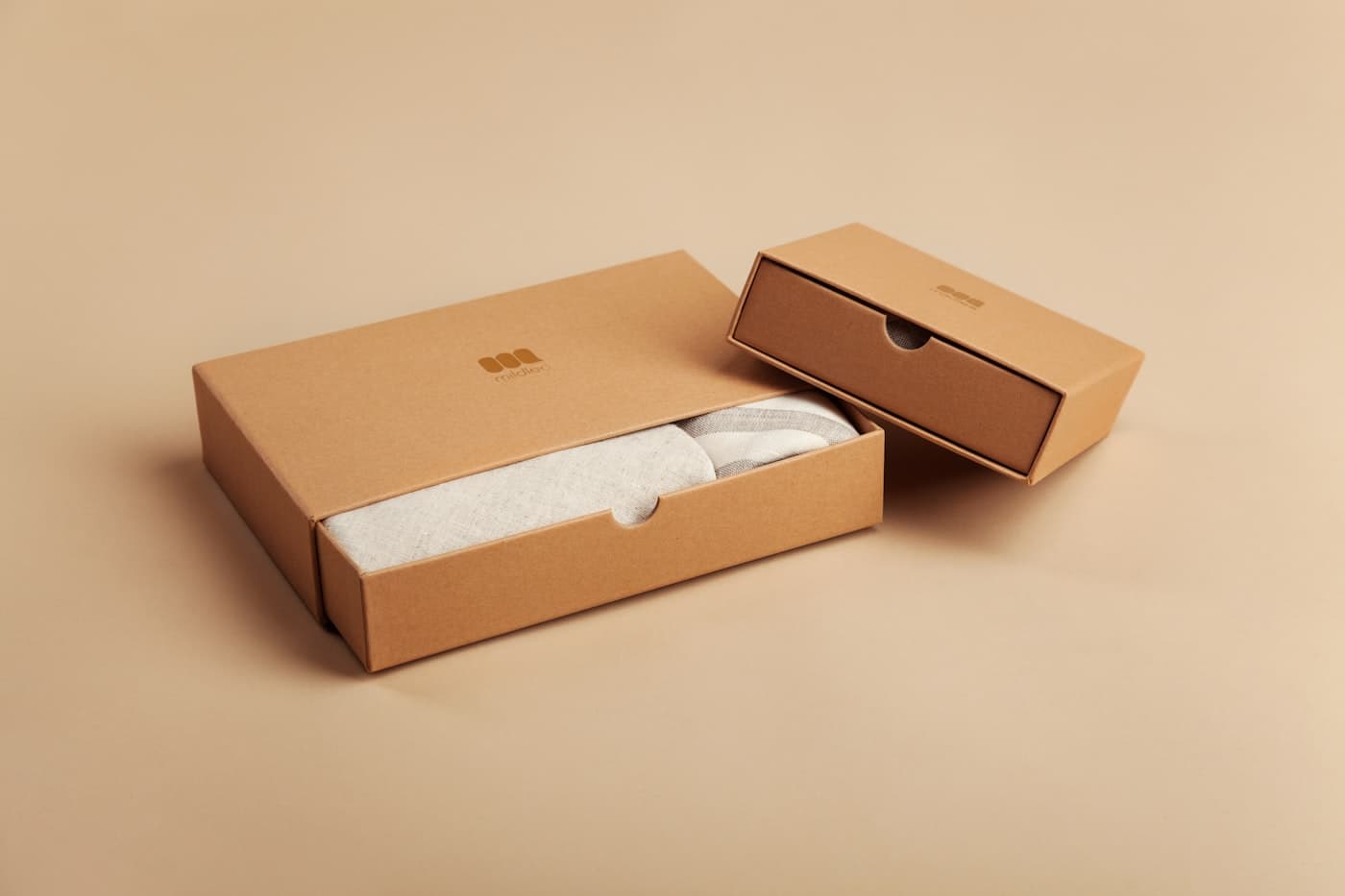 A white die-cut custom carton on a white table