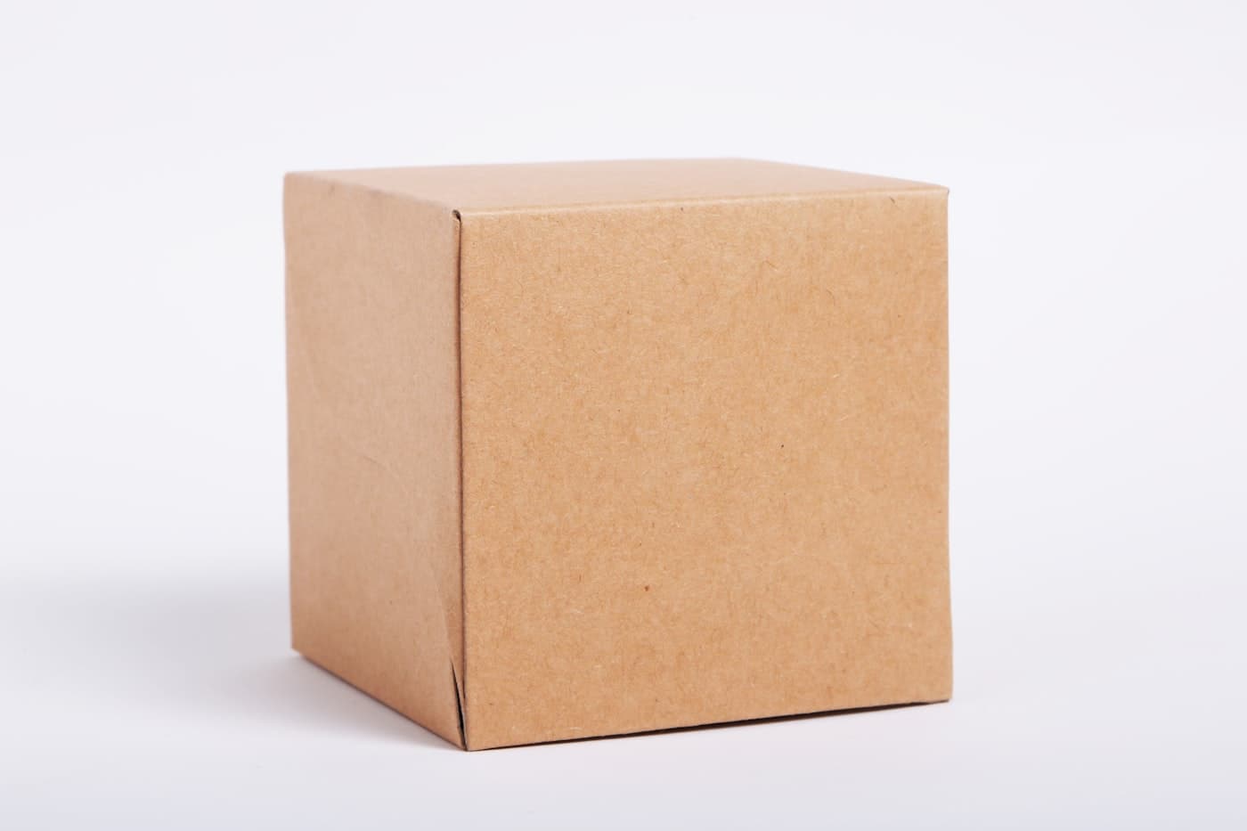 A medium brown corrugated carton on a white background
